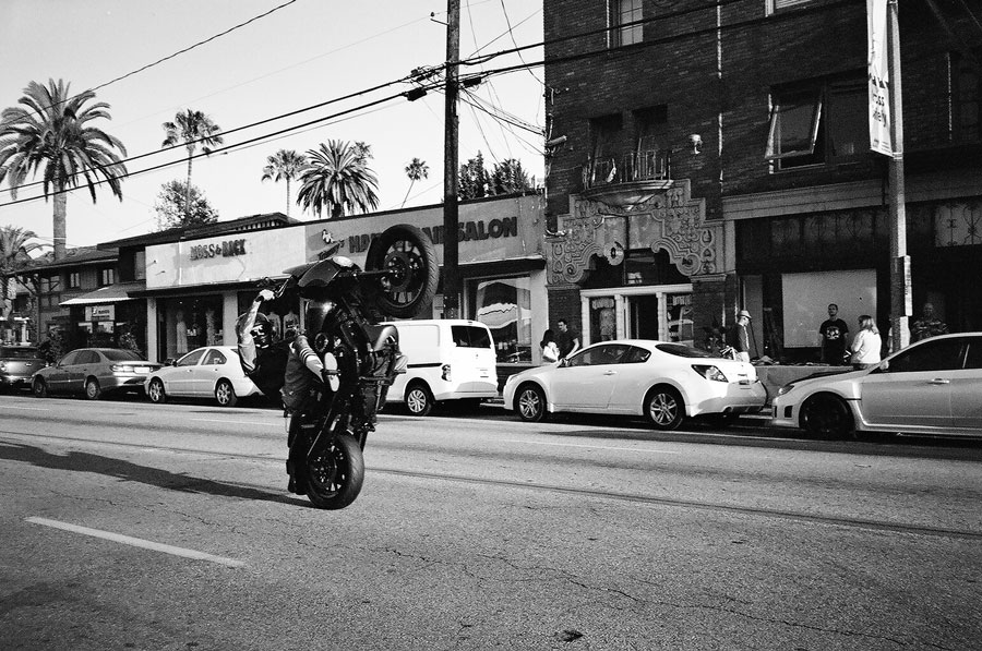 Wheelie down Broadway in Long Beach